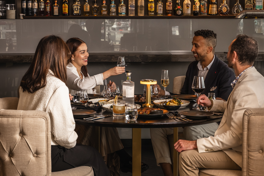 Friends dining and toasting at Callington Mill House of Whisky & Dining at MACq 01 in Hobart