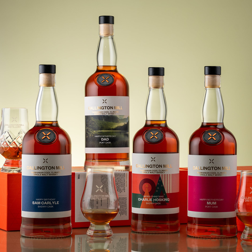 Four personalised Callington Mill Tasmanian single malt whisky bottles with custom name labels